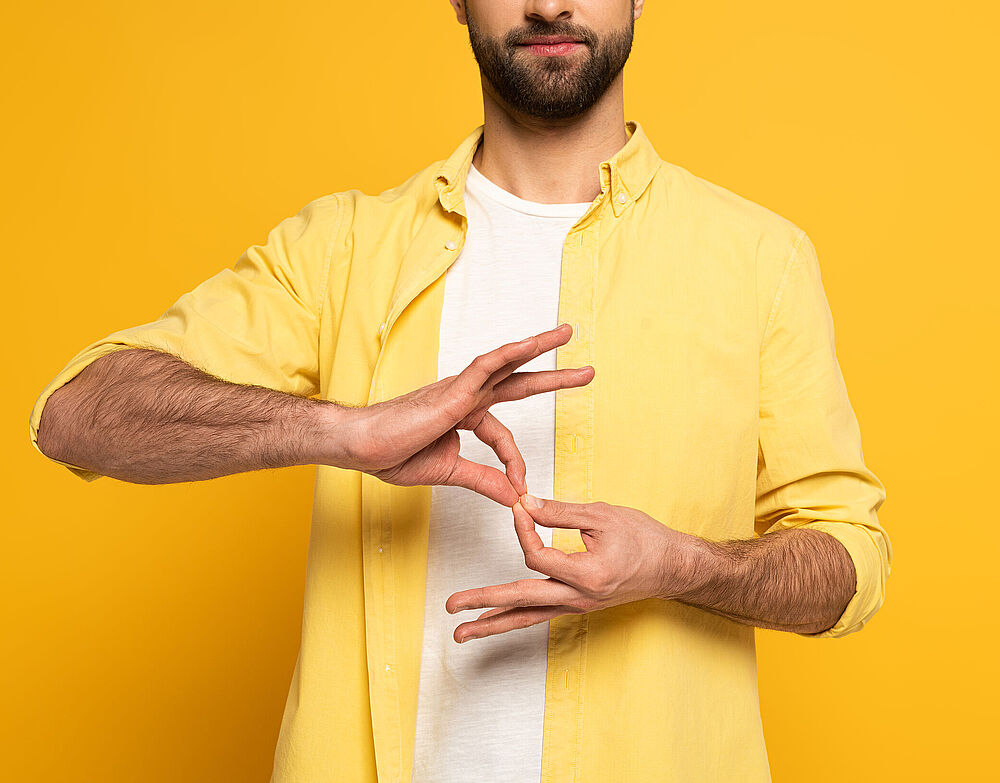 Mann macht Zeichensprache